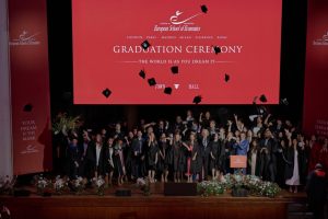 Graduates cap toss on stage at Town Hall by Bottaccio as family and friends capture the moment — ESE Graduation Ceremony, 4th July 2026.