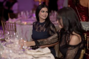 Graduates share a moment at the seated dinner during the 30th Anniversary Gala at Town Hall by Bottaccio.